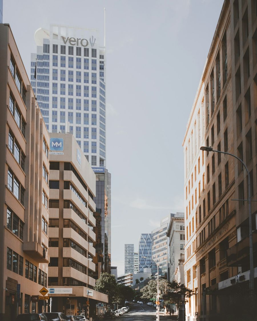 An Auckland CBD street with tall buildings rising behind it